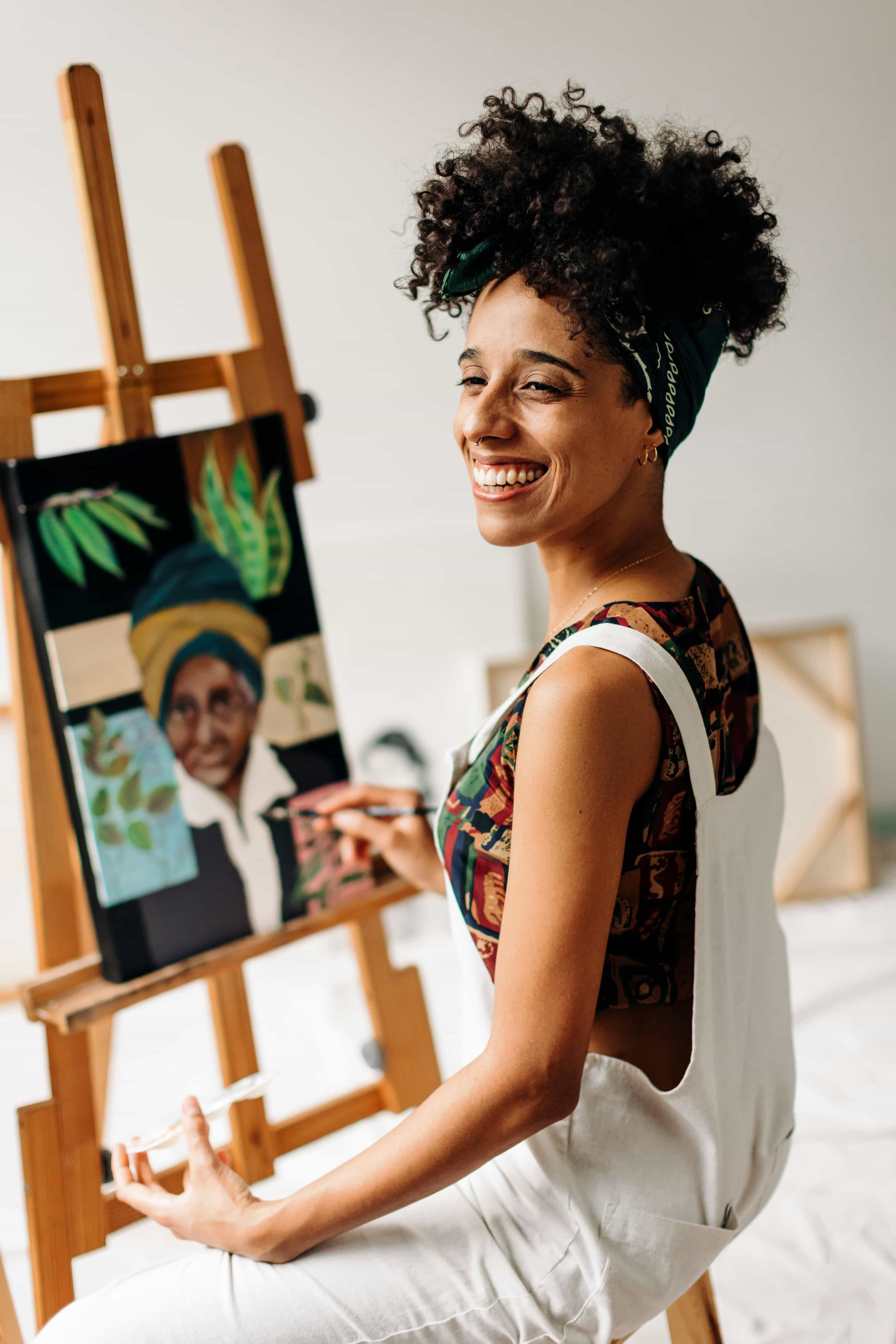 A woman enjoys Painting and art therapy as a part of experiential therapy in Boulder, Colorado