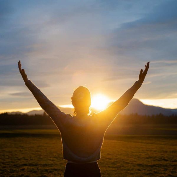 client outdoors at sunrise during holistic treatment program