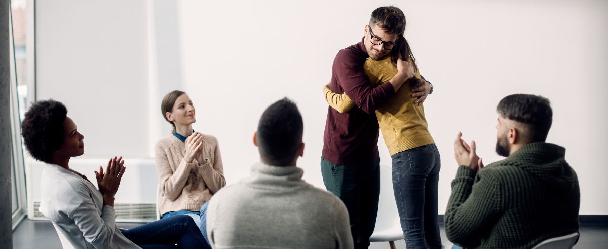 People participating in holistic group therapy for addiction recovery.