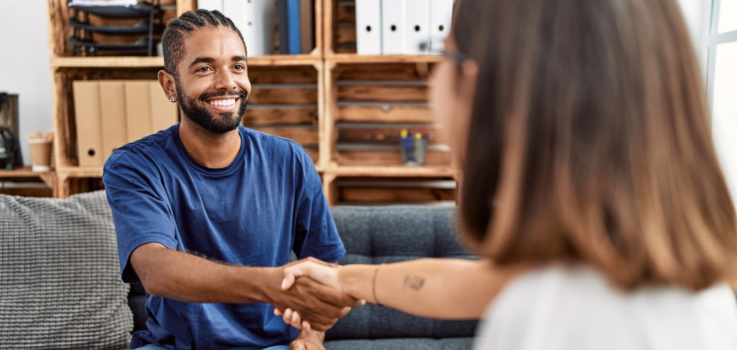 A man greets his therapist at a Cigna rehab in Colorado.