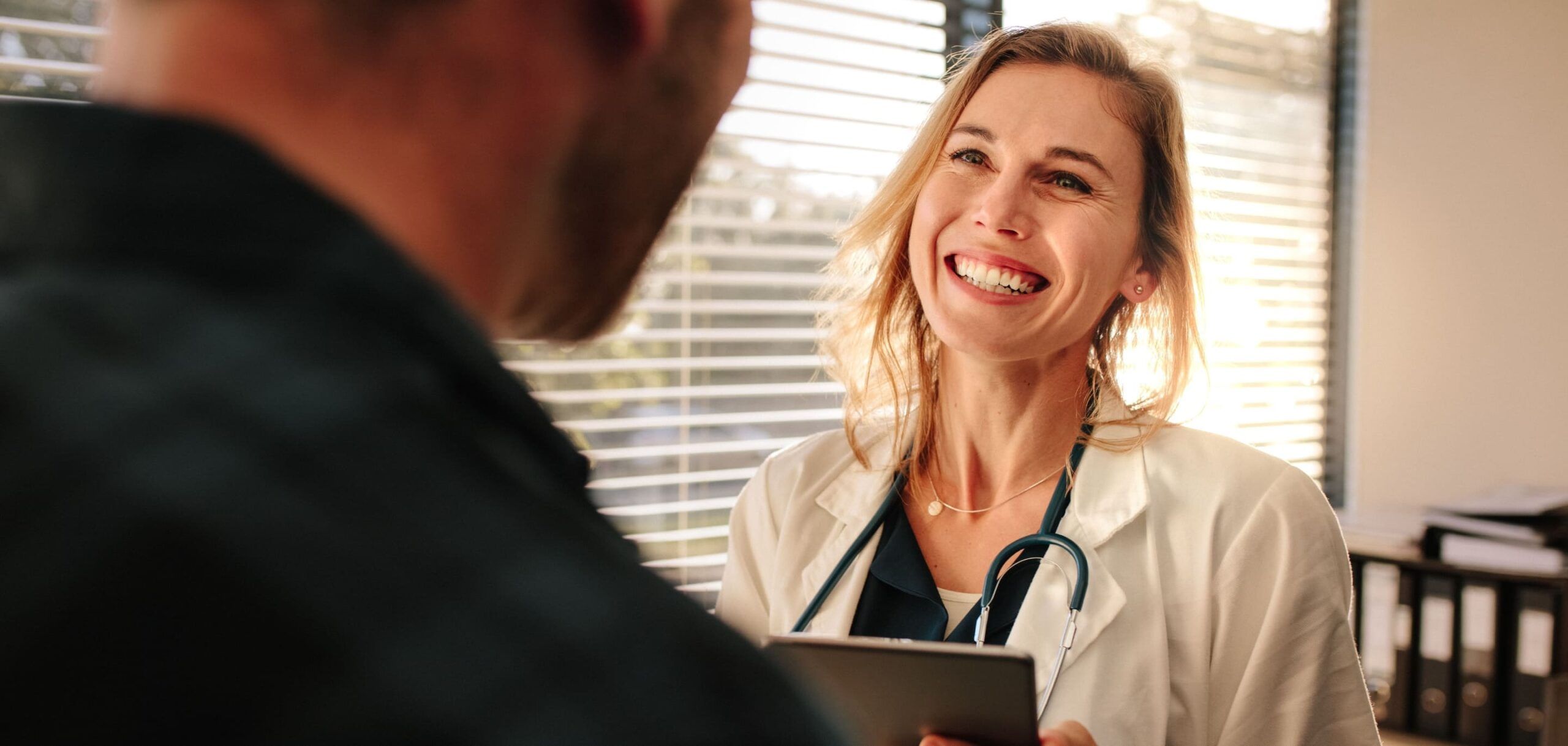 A professional offers assistance to a client at a Cigna Rehab in Colorado.