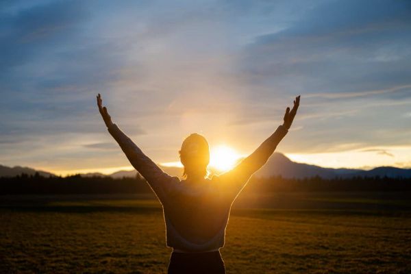 client outdoors at sunrise during holistic treatment program