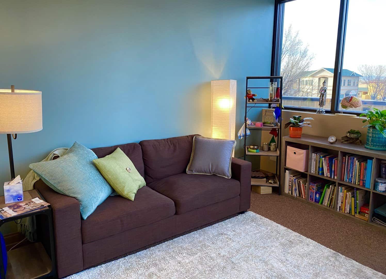 reading area with couch and bookshelves