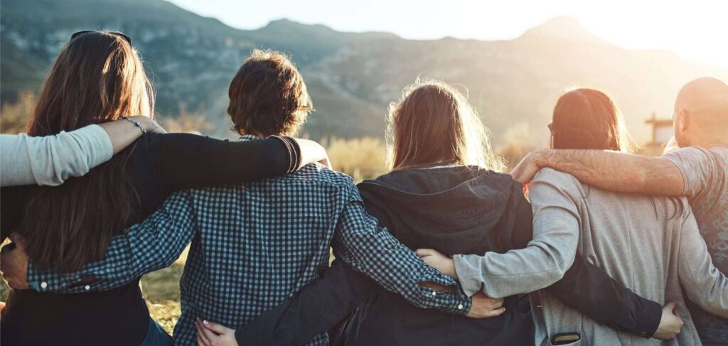 Group of individuals encouraging each other through cocaine addiction treatment in Boulder.