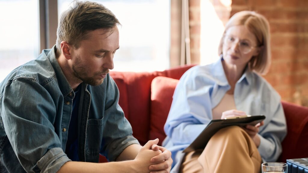 A man talks to a therapist during his heroin addiction treatment in Boulder, Colorado.