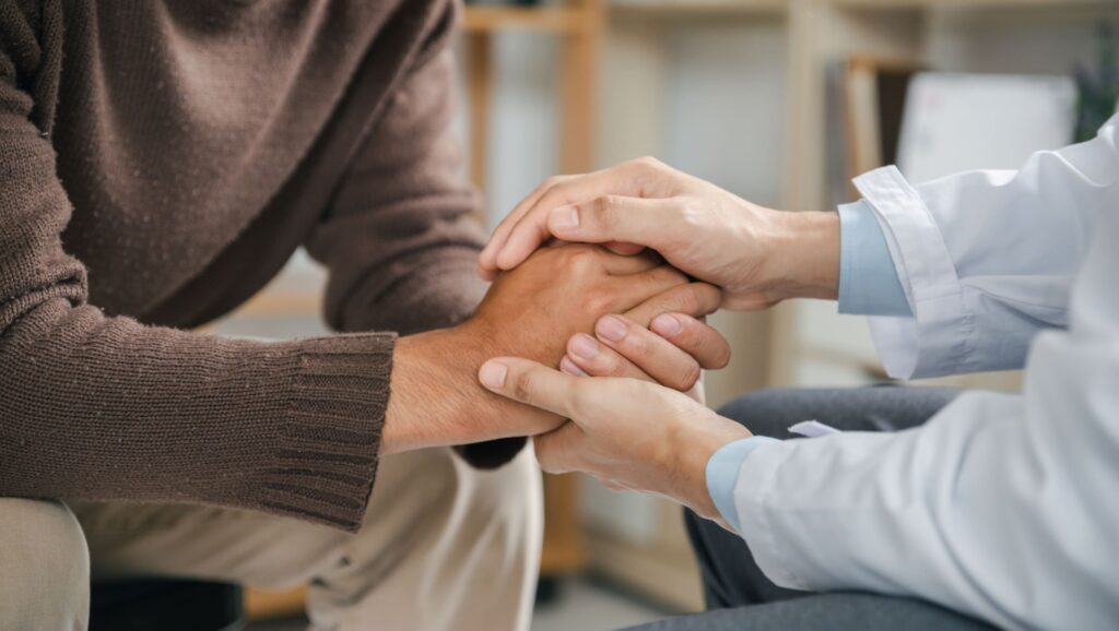 A therapist offers support to a client during his opioid addiction treatment in Boulder, Colorado.