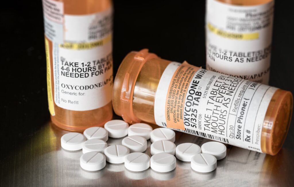prescription drug bottles and tablets