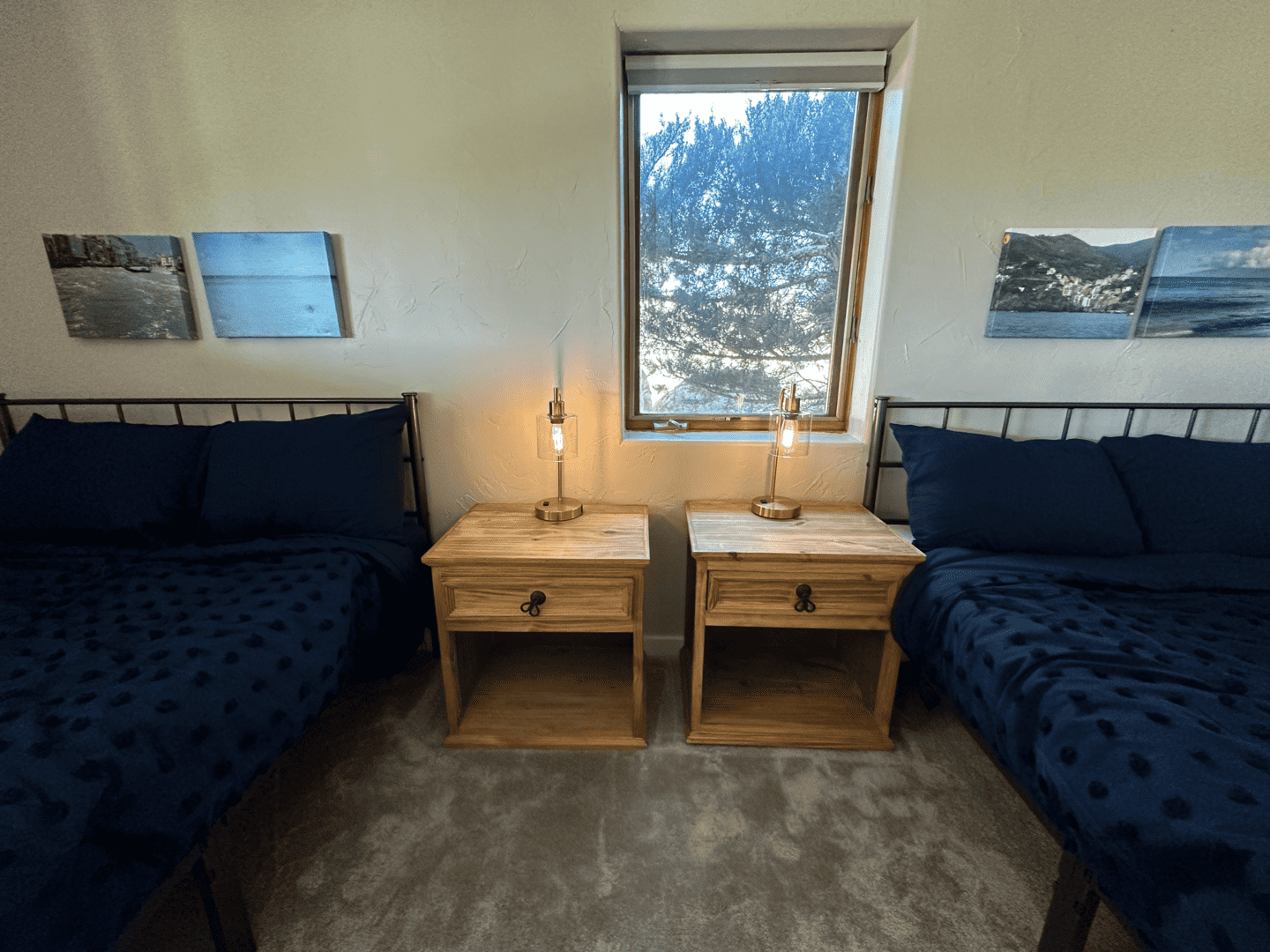 Two beds and two nightstands in between at our sober living in Boulder, Colorado.