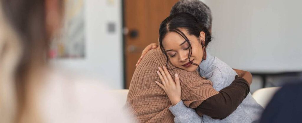 Woman hugging loved one during drug addiction treatment in Boulder, Colorado.