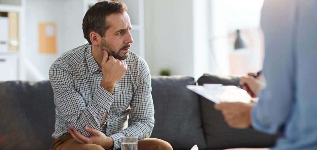 A man dealing with addiction seeks support at alcohol rehab in Boulder, Colorado.