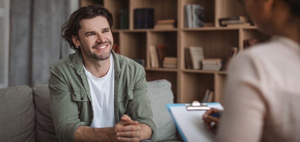 Man consults therapist for aftercare during anxiety treatment in Boulder, Colorado. 