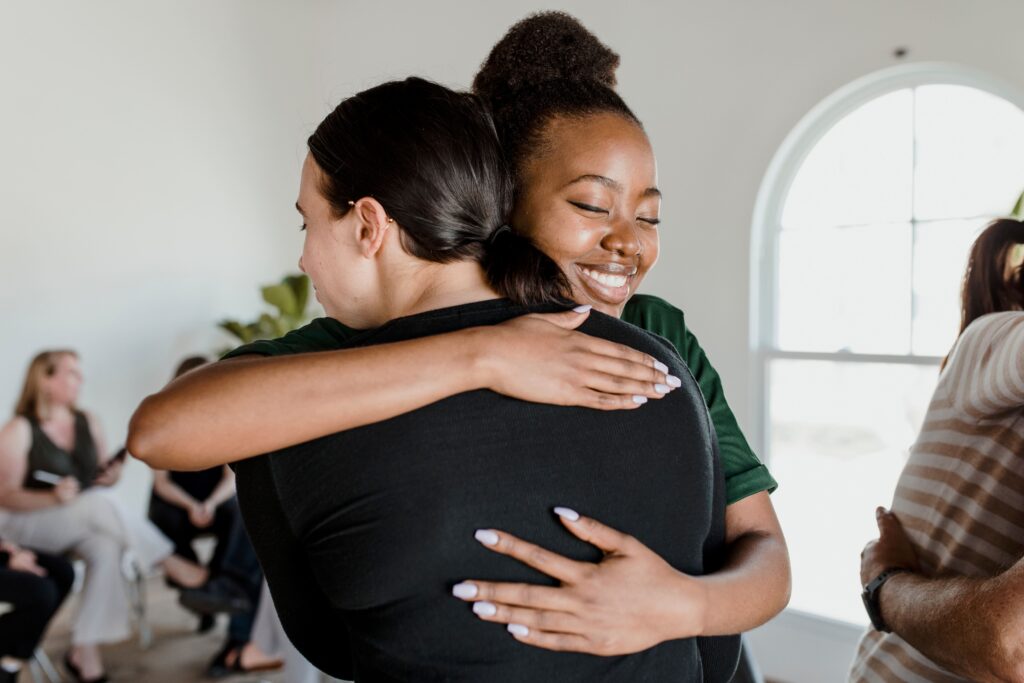 A woman shares her experience during a group session through Trauma treatment in Boulder, Colorado 