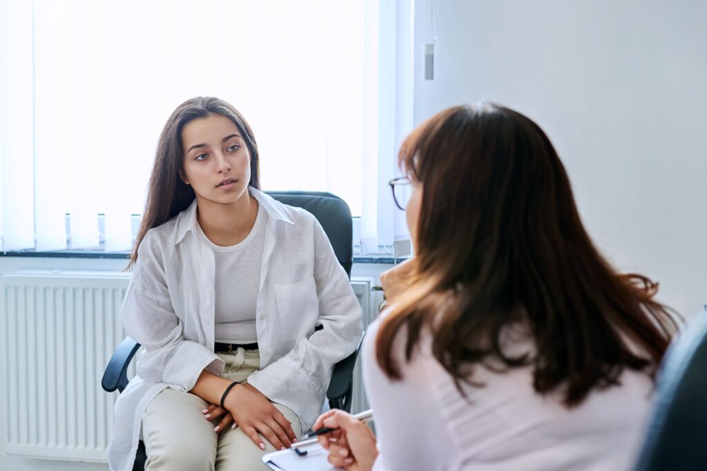 A woman talks to a mental health professional during Trauma treatment in Boulder, Colorado 