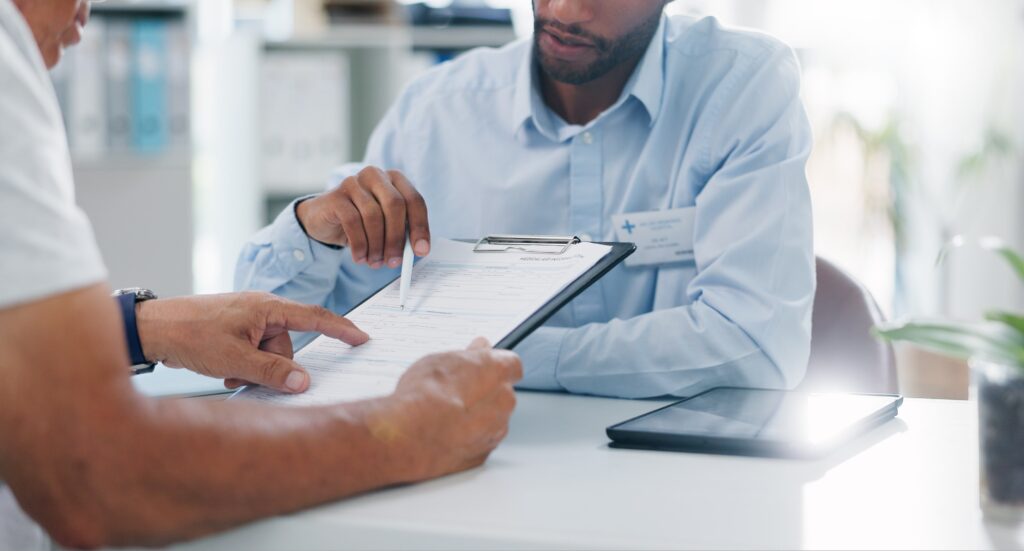 A man discusses BCBS rehab in Colorado with his doctor.