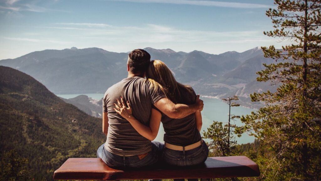 A man supporting a woman during postpartum depression treatment in Boulder, Colorado.