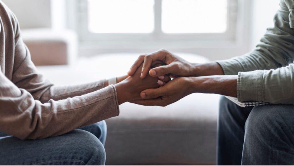 A therapist offers support to a woman during postpartum depression treatment in Boulder, CO.