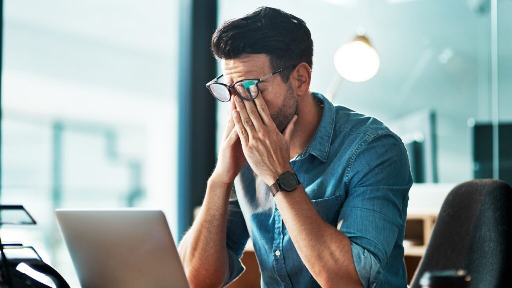 A man at work suffering from being a high-functioning alcoholic