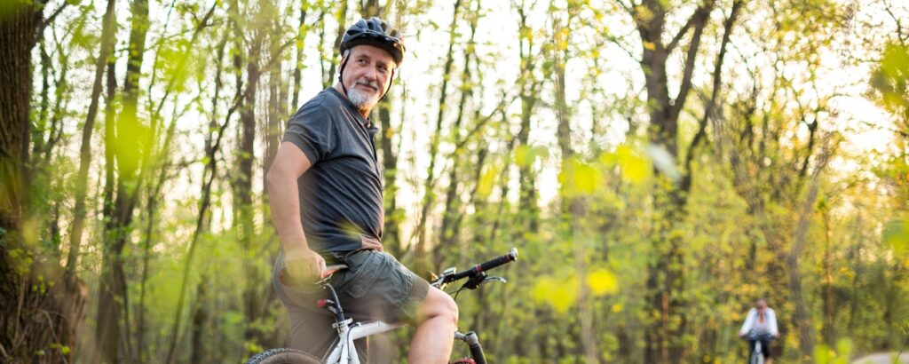 A man enjoys biking in nature after healing through our intensive outpatient program in Boulder, Colorado
