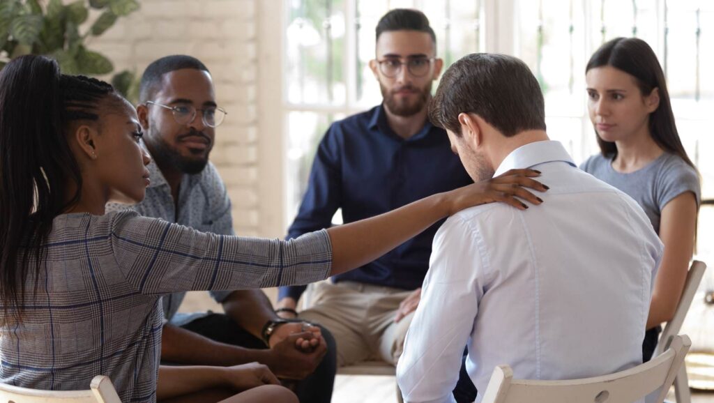 Supportive group therapy session at a Colorado rehab for professionals.