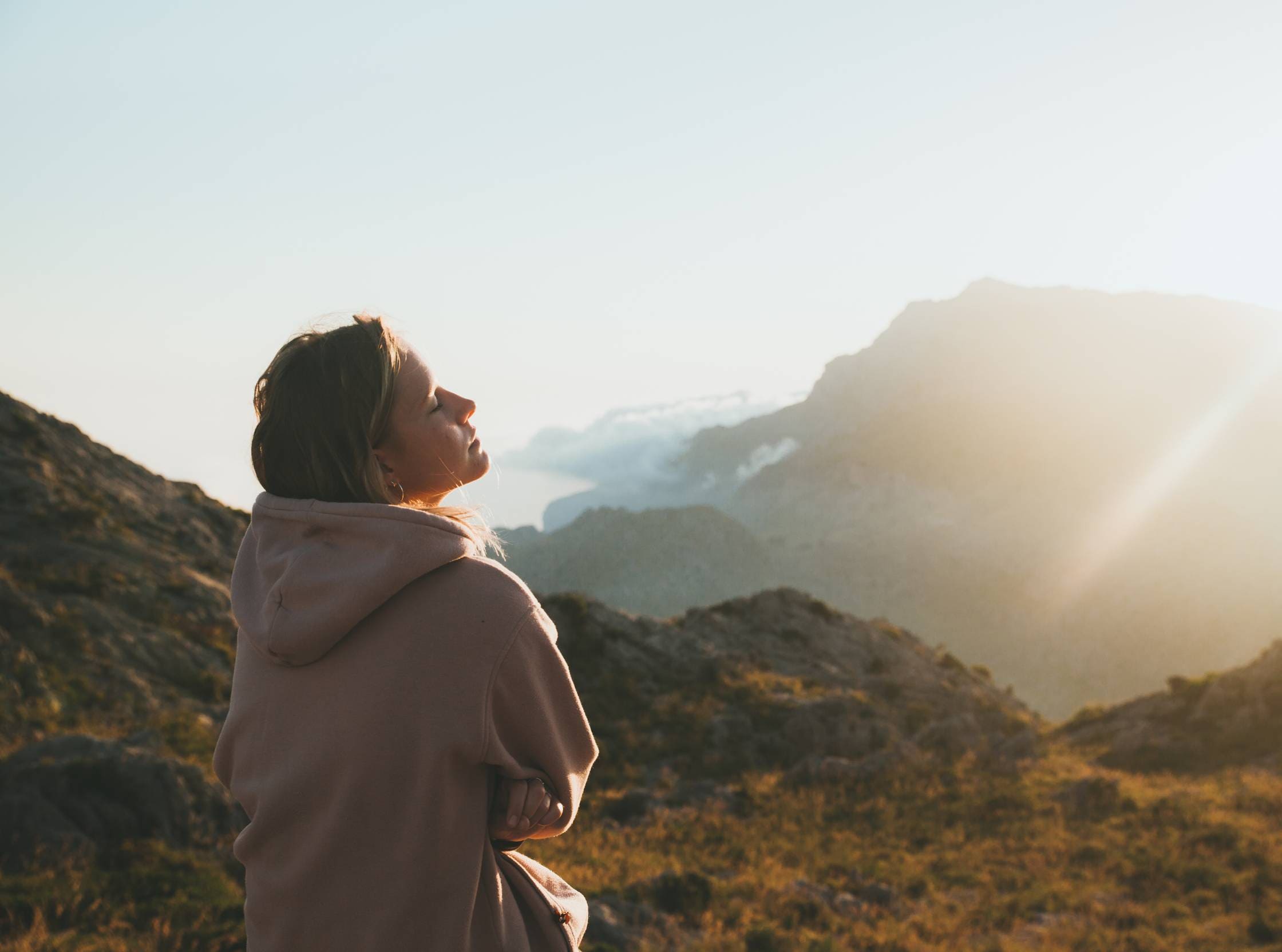 Woman in recovery feeling renewed at a United Healthcare rehab in Colorado.