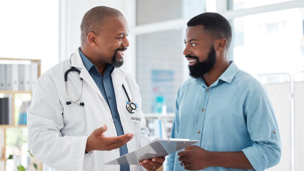 A man consults his doctor about whether he should choose detox vs rehab