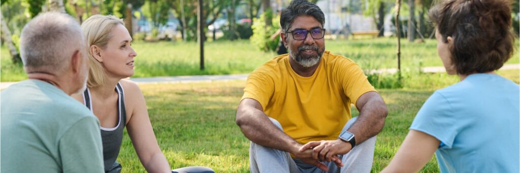 A group treatment session outdoors during holistic mental health treatment.