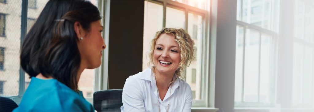 A woman discusses a personalized treatment plan with her therapist during acute stress disorder treatment in Boulder