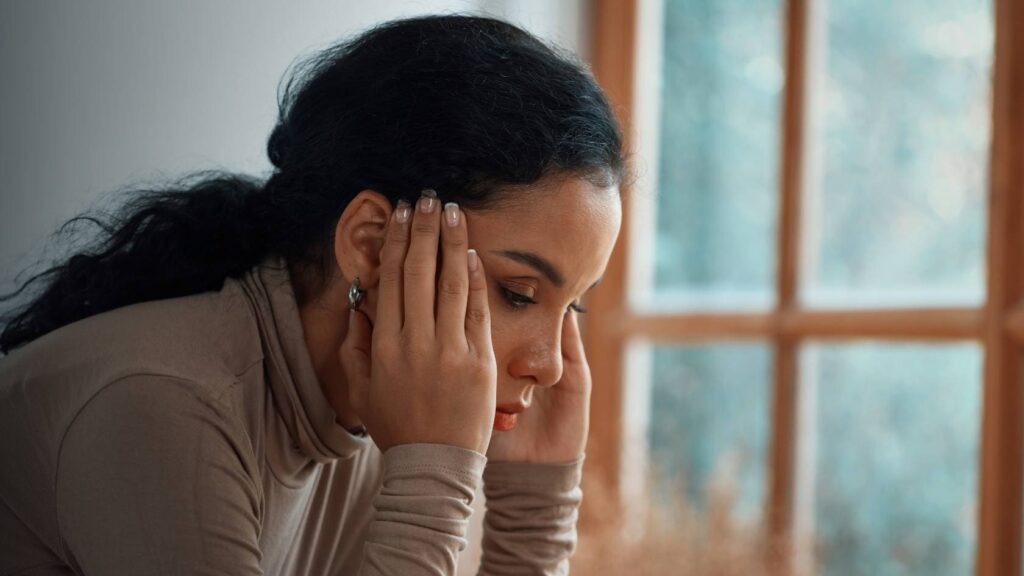 Woman reflecting on her need for ADHD treatment in Boulder, Colorado.