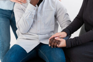 Supportive hands during oxycodone addiction treatment in Boulder CO recovery session