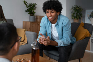 Person sharing feelings during LGBTQI+ drug rehab in Boulder therapy session